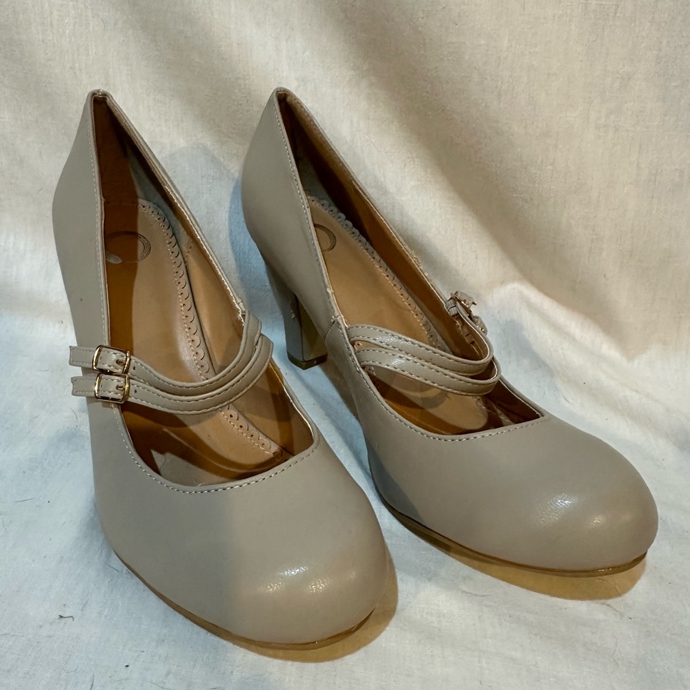 Woman’s light grey high heels